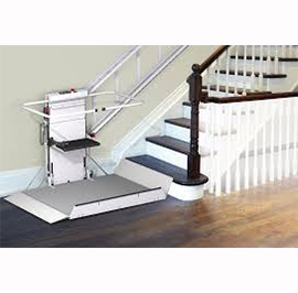 Stair Lifts - View of stair lift located at the botttom of a staircase Stair Lifts